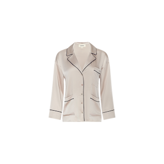 The Mara Blouse in light pink satin features black piping, long sleeves, a button-down front, notched collar, and chest pocket for a relaxed fit that’s perfect for loungewear, displayed on a plain white background.