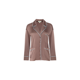 The Mara Blouse features a relaxed fit in brown satin, long sleeves, a collared neckline, and white piping accenting the edges and pockets; displayed against a plain white background—ideal for versatile loungewear or styled elegantly as a satin blouse.