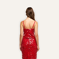 Back view of a person wearing a bright red Lior Sequin Top with thin straps and structured cups.