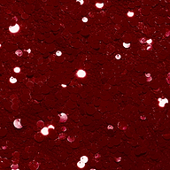 Close-up of the Lior Sequin Top, a deep red sequin garment with reflective highlights.