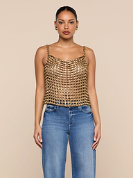 A woman stands facing forward, wearing the Joanette Embellished Tank with a gold chainmail-style design and blue jeans against a plain white background.