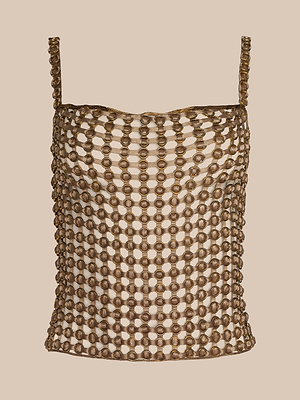 The Joanette Embellished Tank is a metallic, hand-woven chainmail-style top with thin straps and an open pattern of interlinked rings, shown against a neutral beige background.