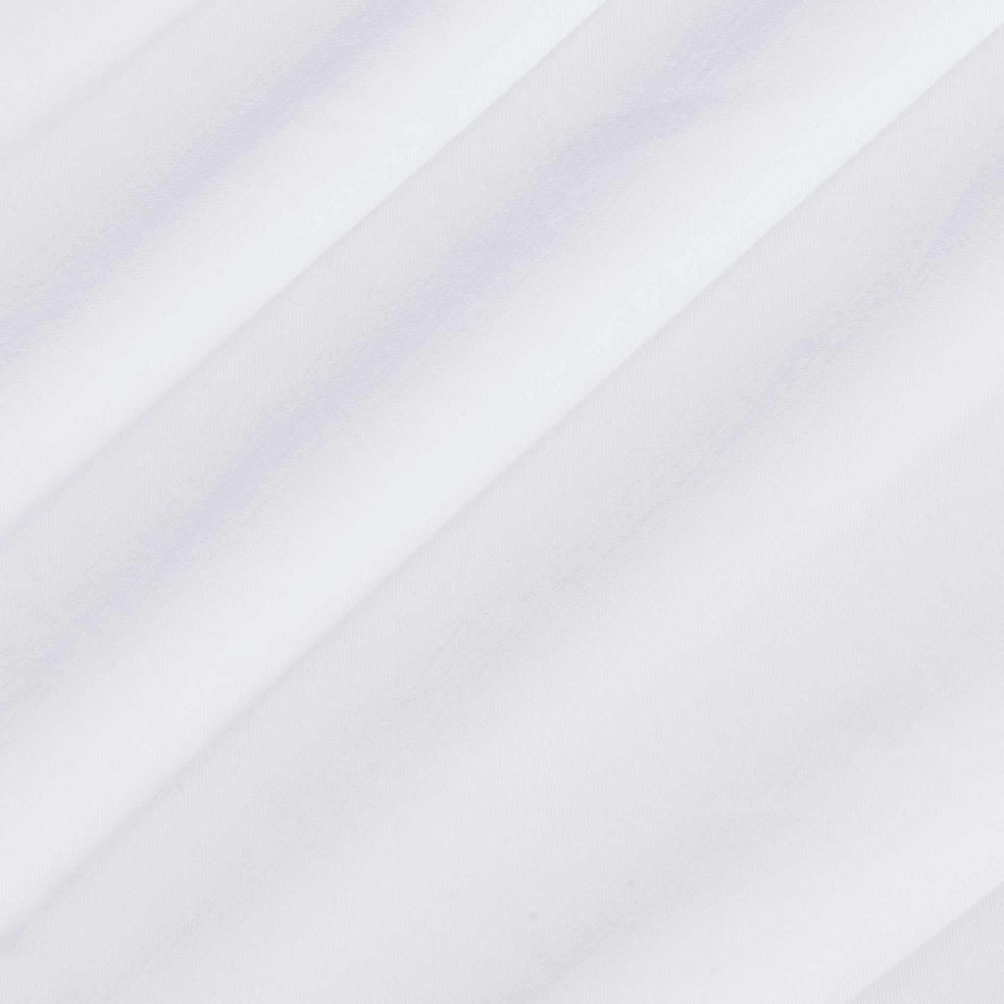 Close-up of the Sarai Off-the-Shoulder Top’s smooth, white organic cotton-blend fabric, featuring subtle diagonal folds and soft shadows for a minimal, clean appearance.
