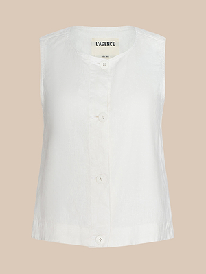 The Foster Linen Top is a sleeveless summer blouse in crisp white, featuring a round neckline and large front buttons, shown against a beige background. The inner label reads L’AGENCE.