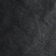 Close-up of the Tullia Scoopneck Tank in textured black vegan leather, showing subtle grain patterns and natural creases. The image highlights the quality material of this stretch leather tank, capturing its sophisticated look.