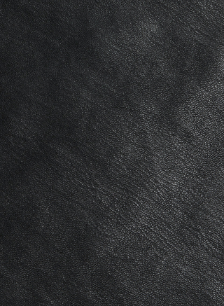 Close-up of the Tullia Scoopneck Tank in textured black vegan leather, showing subtle grain patterns and natural creases. The image highlights the quality material of this stretch leather tank, capturing its sophisticated look.