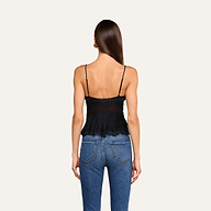 A woman with long straight hair is shown from the back, wearing the Elka Satin Lace Camisole and blue jeans, standing against a plain light background.