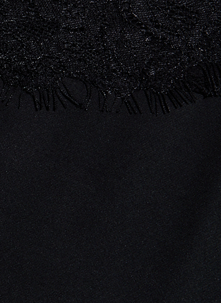 Close-up of the Elka Satin Lace Camisole featuring black lace fabric with a floral pattern and delicate lace trim at the top, seamlessly transitioning into smooth, solid black satin fabric at the bottom.