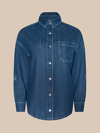 Jorah Oversized Shirt in blue featherweight denim, featuring long sleeves, a single left chest pocket, silver buttons, and visible stitching, displayed on a plain beige background.