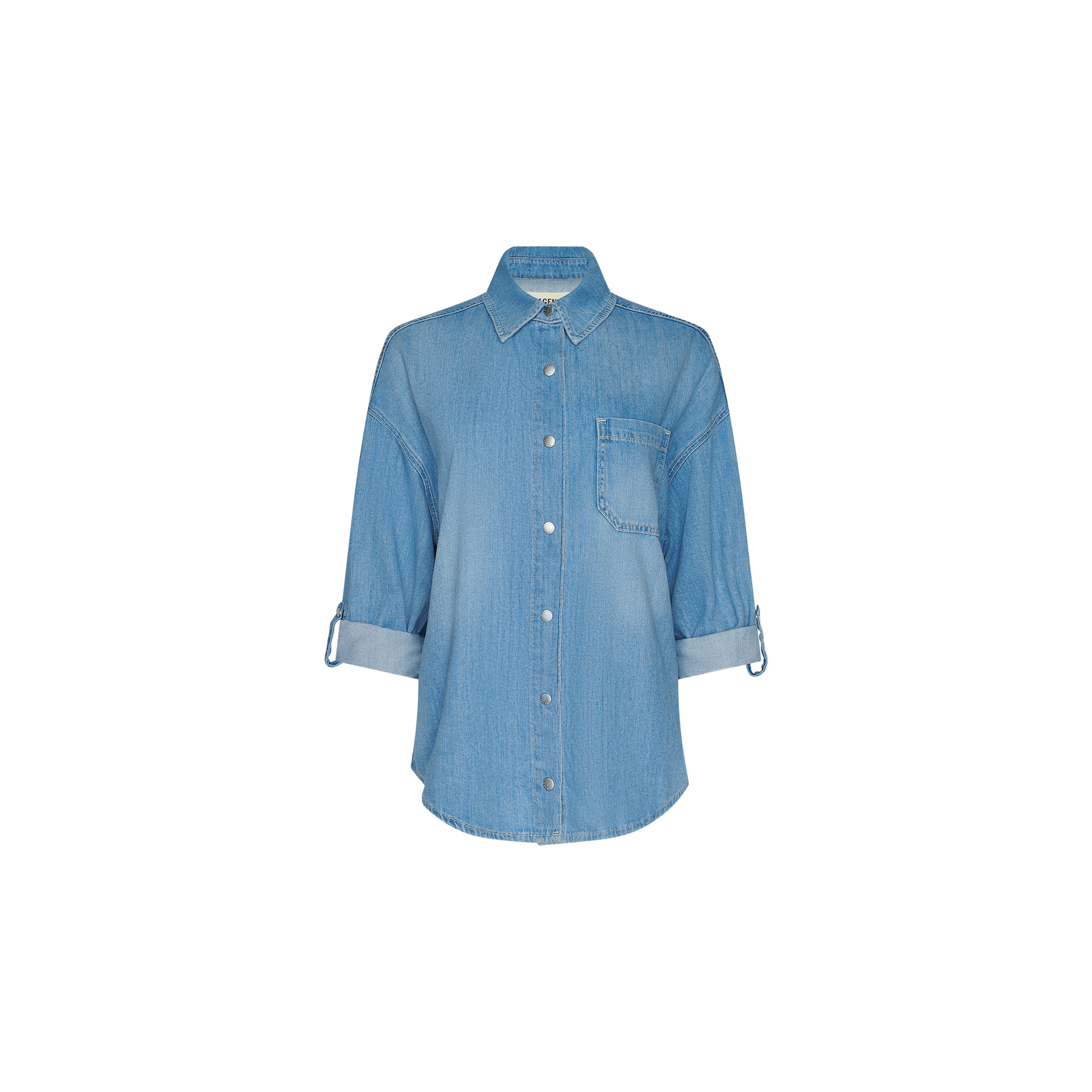 The Jorah Oversized Shirt is a light blue featherweight denim button-up with a collar, single chest pocket, and rolled-up sleeves, shown against a plain white background.