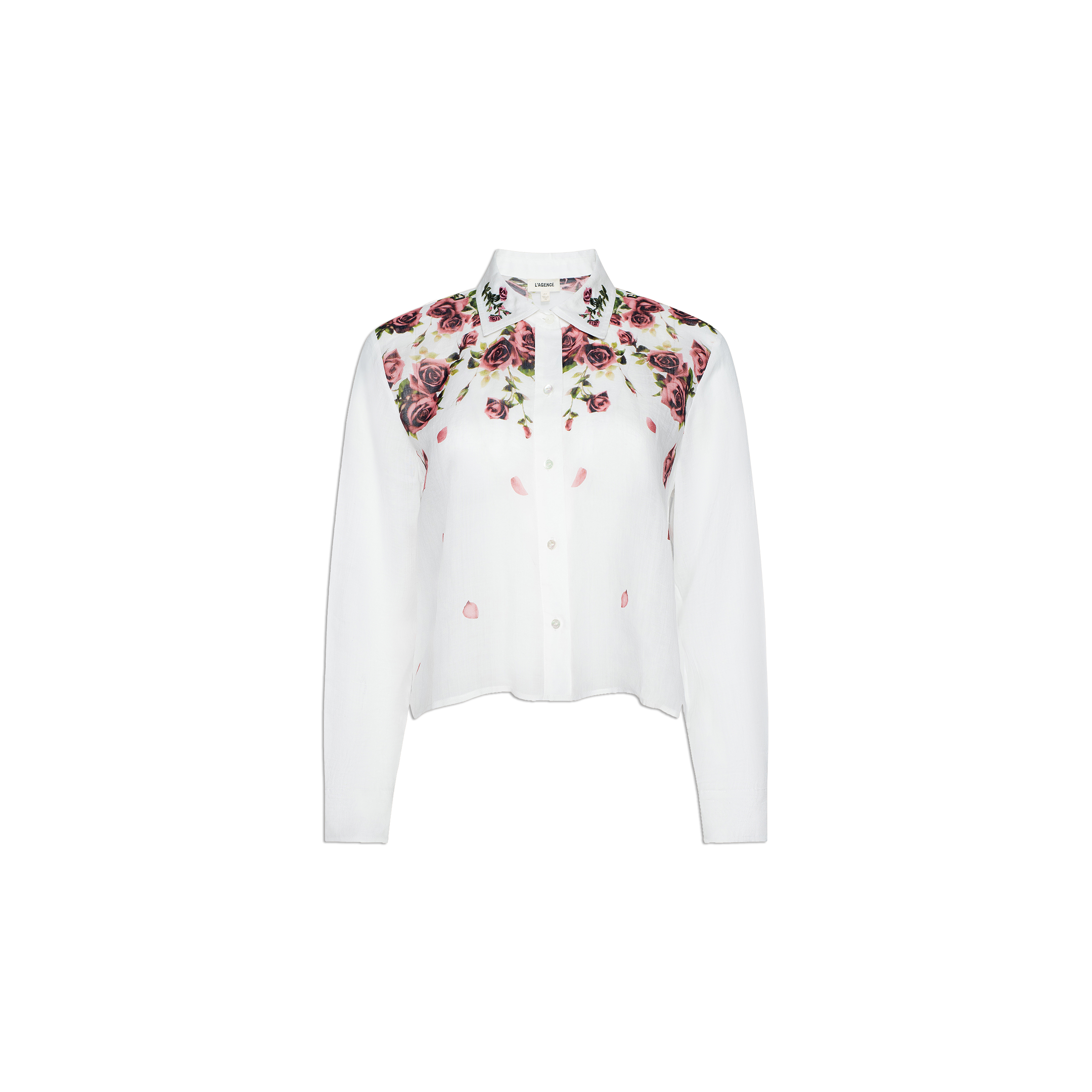The Philomena Blouse features a white, long-sleeve button-down design with a collared neckline. A floral pattern of pink and purple roses with green leaves accents the top front section and shoulders. Crafted from semi-sheer Ramie, this blouse offers an airy, elegant finish.