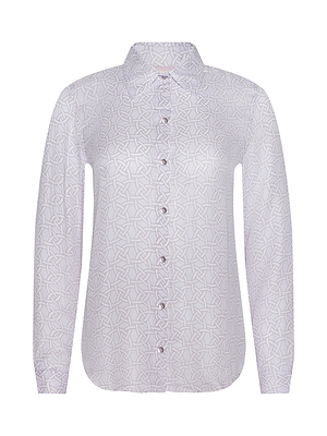 The Nina Silk Blouse is a light purple, relaxed-fit button-down featuring a subtle geometric line print, pointed collar, and curved hem. It is shown against a plain white background.