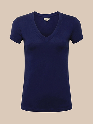 The Becca Cotton V-Neck Tee, a plain navy blue short-sleeved shirt made from 100 cotton, is shown against a light beige background.