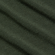 Rich dark green fabric of the Aja Turtleneck, featuring a soft knit texture and diagonal folds that create gentle shadows and highlights across its surface.