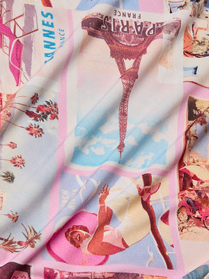 The Ressi Fitted Tee features colorful stretch jersey knit with retro travel poster prints, including the Eiffel Tower Paris, France and Cannes palm trees in pastel tones—slightly wrinkled for vintage style.