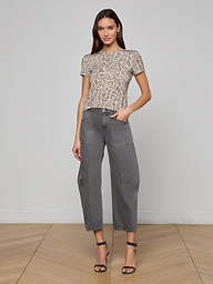 Woman wearing the Ressi Fitted Tee in gray leopard print, paired with gray cropped pants and black high-heeled sandals, standing against a plain white background.