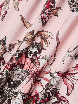 Close-up of the Ressi Fitted Tee fabric featuring a pink background with detailed butterfly jungle print in pink, red, black, and beige. The design showcases overlapping large butterflies and flowers.