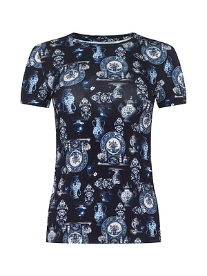 The L'AGENCE Ressi Fitted Tee is a stretch jersey knit with short sleeves, showcasing an allover blue and white porcelain vase and plate print on a dark background for a classic ceramic-inspired look.
