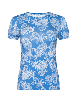 The Ressi Fitted Tee, a blue short-sleeve bestselling style, features an intricate white paisley pattern all over its stretch jersey knit fabric and is shown on a plain white background.