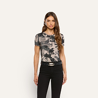 Woman wearing a Ressi Fitted Tee featuring a magazine collage print with black jeans.