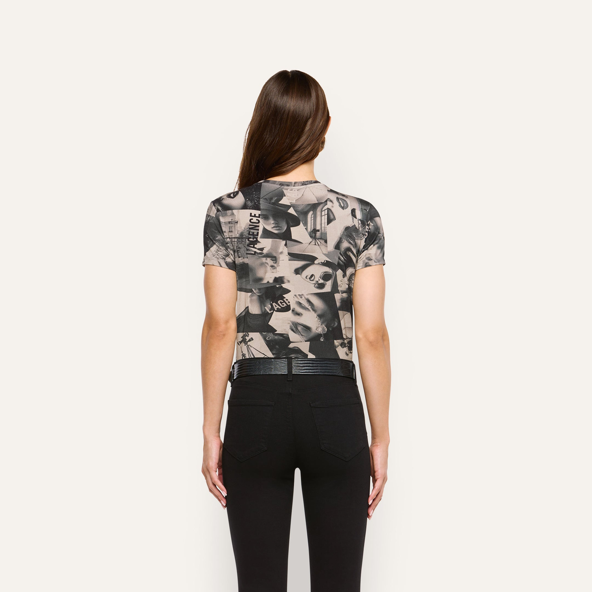 Ressi Fitted Tee in a soft jersey short-sleeve style featuring a black-and-white magazine collage print, worn with black pants.