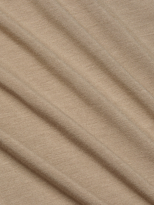Close-up of light brown, ribbed fabric from the L'AGENCE Ressi Fitted Tee. The ultra soft jersey has fine vertical lines, smooth texture, subtle stretch, and diagonal folds that create a soft, textured appearance.