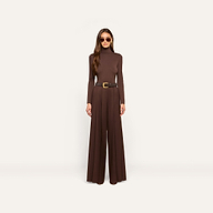 Woman standing against a plain background, wearing the dark java brown Lani Turtleneck in a slim fit, matching wide-leg pants, a black belt with a gold buckle, and sunglasses.