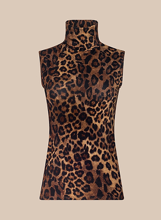 Ceci Sleeveless Turtleneck showcasing a striking brown and black leopard print and a figure-hugging slim silhouette, set against a plain beige background.