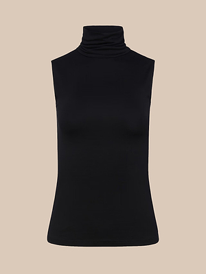 The Ceci Sleeveless Turtleneck is a slim fit black top made from luxe microfiber, shown against a plain beige background.