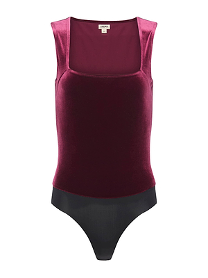 The L'AGENCE Molly Velvet Bodysuit showcases a rich burgundy top with a square neckline and sleek black bottom. Sleeveless and chic, this statement piece is perfect for any look. Displayed on a white background.