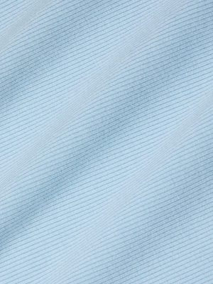 Close-up of soft, light blue fabric with fine horizontal stripes and subtle shadows highlights the textured look of the Nica Scoopneck Bodysuit—a sculpted, comfortable base layer.