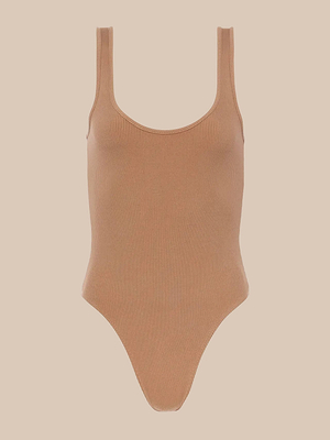 The Nica Scoopneck Bodysuit features a stretch rib texture, sleeveless design, scoop neckline, and high-cut legs, shown against a plain beige background.