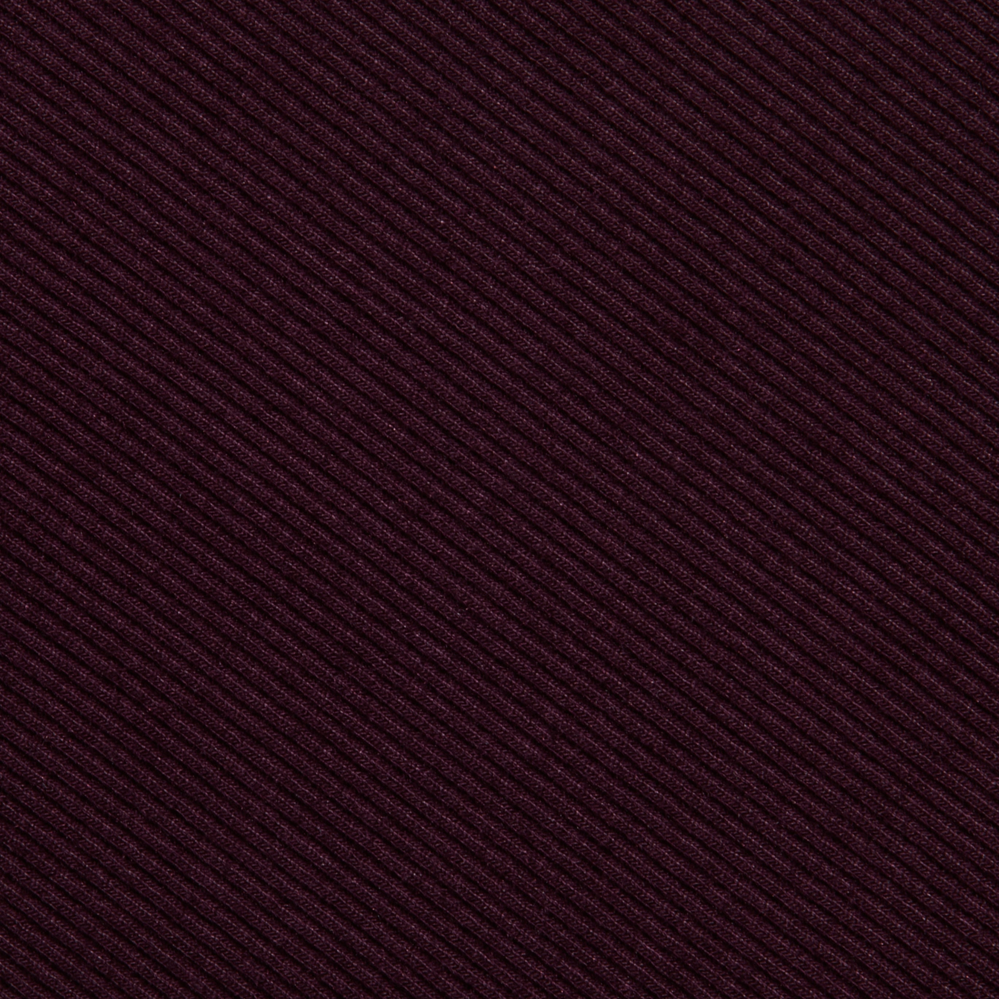Close-up of the Nica Scoopneck Bodysuit’s textured fabric, showcasing diagonal ribbed lines in a deep burgundy hue and featuring high recovery stretch—perfect for a base layer.
