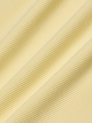 Close-up of pale yellow, ribbed fabric with diagonal lines and soft shadows, forming a wavy texture—ideal as a base layer or for the sculpted fit of the Nica Scoopneck Bodysuit.