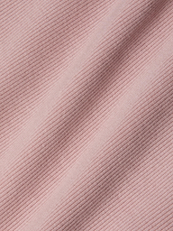 Close-up of pink ribbed fabric with diagonal textured lines and soft shadows, highlighting the detailed weave and pattern of this sculpted fit textile—perfect for the Nica Scoopneck Bodysuit.