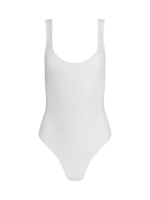 The Nica Scoopneck Bodysuit is a sleeveless, white, ribbed base layer with a scoop neckline and high-cut legs, shown against a white background for versatile styling.