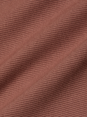 Close-up of the Adira Scoopneck Tank in brown shows its fitted ribbed fabric with fine horizontal lines, subtle folds, soft texture, and a slight sheen.