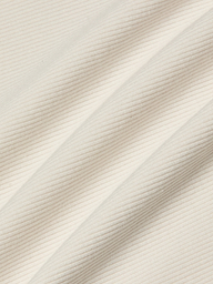 Close-up of the Adira Scoopneck Tank in cream-colored fitted stretch rib fabric, featuring diagonal ridges that form a textured pattern of fine, parallel lines.