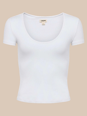 The Brynlee Scoopneck Tee is a plain white, short-sleeve stretch cotton ribbed top with a scoop neckline, shown against a beige background.