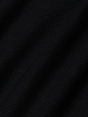 Close-up of the black ribbed fabric with diagonal ridges and fine lines, highlighting the texture of L'AGENCE's Evelyn Off-The-Shoulder Bodysuit.