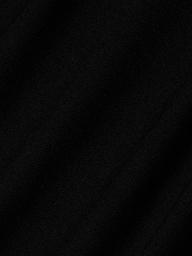 Close-up of black fabric with a subtle diagonal weave pattern visible in the texture, characteristic of the Stormy Cropped Cotton Tee crafted from organic cotton in a semi-relaxed fit.