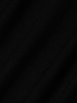 Close-up of the Stormy Cropped Cotton Tee, made from black organic cotton fabric with subtle diagonal lines and a soft texture—perfect for a semi-relaxed fit.