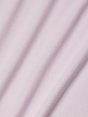 Close-up of the Stormy Cropped Cotton Tee in light pink organic cotton, showing soft diagonal folds and a smooth, slightly stretchy fabric—ideal for a semi-relaxed or cropped fit with gentle shadows and subtle texture.