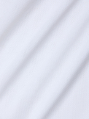 A close-up of the Kalea Mesh Bodysuit shows smooth white fabric with soft diagonal shadows and gentle lines. The fine, slightly matte texture highlights the lightweight, mesh design of this elegant bodysuit.