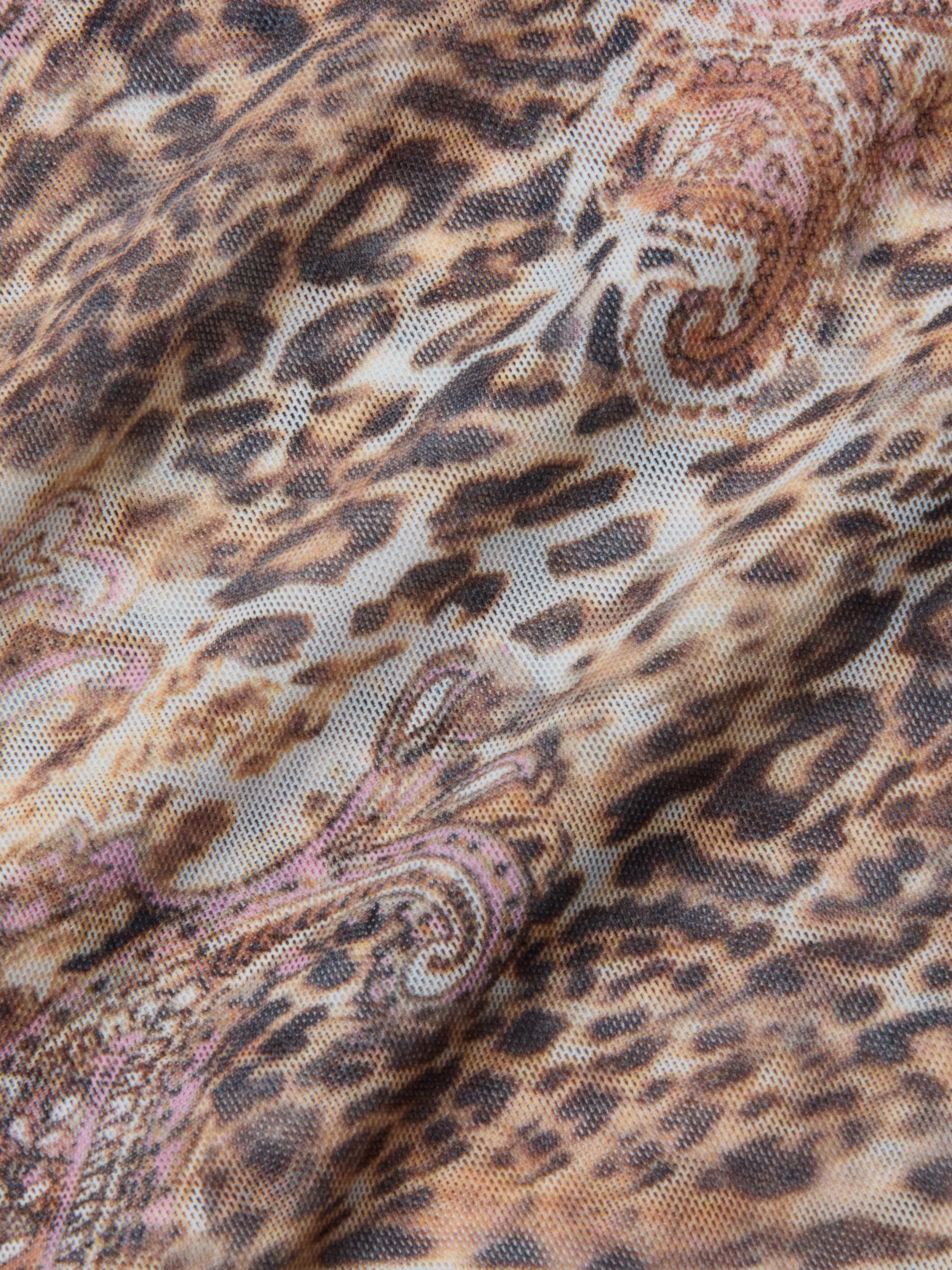 Close-up of the Kalea Mesh Bodysuit, showcasing its lightweight mesh fabric with a leopard paisley print in brown, black, and beige tones, highlighting the texture and gentle folds.