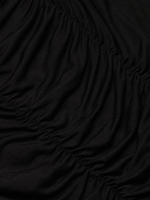 Close-up of the Baliegh Ruched Bodysuit in black rayon stretch jersey, featuring gathered ruched sections that create soft, curved folds. The slightly shiny fabric gives a textured, elegant look under the light.