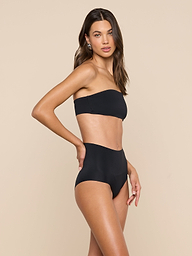 A woman poses in the Mietta Knit Bandeau Top and high-waisted bikini bottoms against a plain light background.