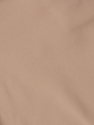 A close-up of the Mietta Knit Bandeau Top’s light brown fabric highlights its smooth texture, fine weaving, and gentle folds—perfect for a supportive fit as an everyday undergarment.
