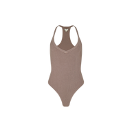 The Wrenna Racerback Bodysuit features taupe rib fabric, a V-neckline, sleeveless racerback design, and high-cut leg openings, shown against a plain white background.