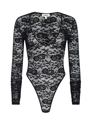 The Thalassa Bodysuit is a black, long-sleeve lace one-piece with floral patterns, high-cut legs, and a scoop neckline—evoking historical romance. Shown on a white background. Ideal for Fall 2026 or New York Fashion Week.